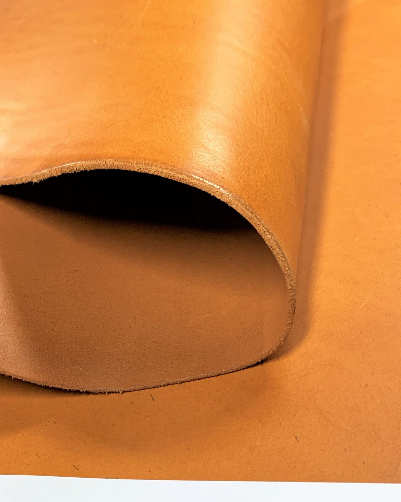 Close up texture of premium full-grain tan leather hide