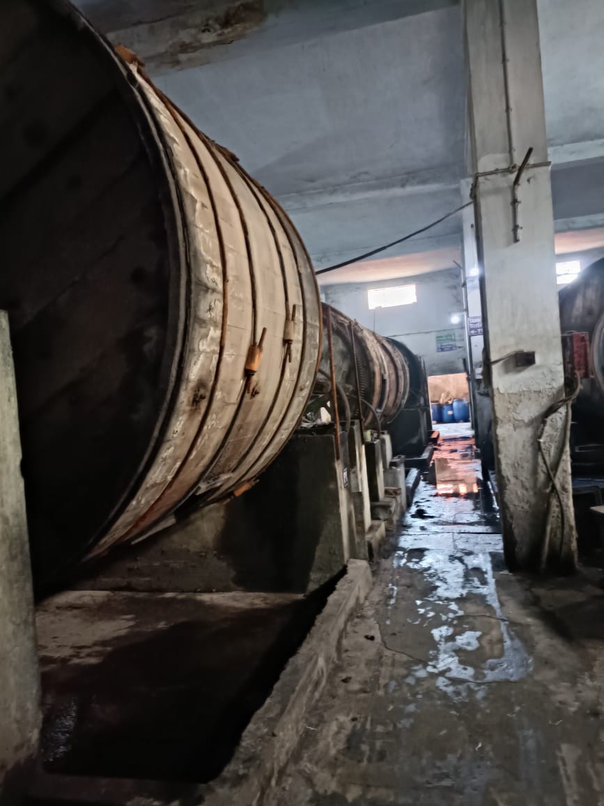 Massive wooden tanning drums at Kolkata Complex